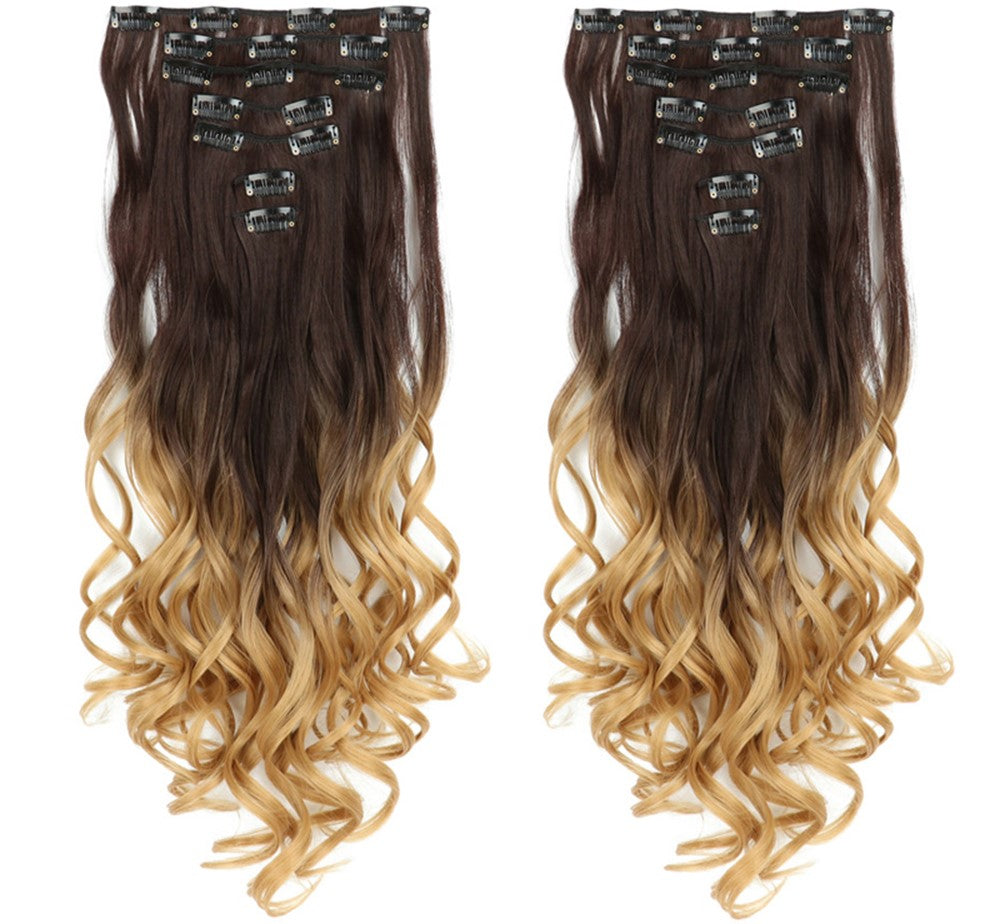 This image showcases a variety of hair extensions and wigs arranged neatly against a soft background. It presents different styles and textures, providing options for enhancing and transforming hair appearances.